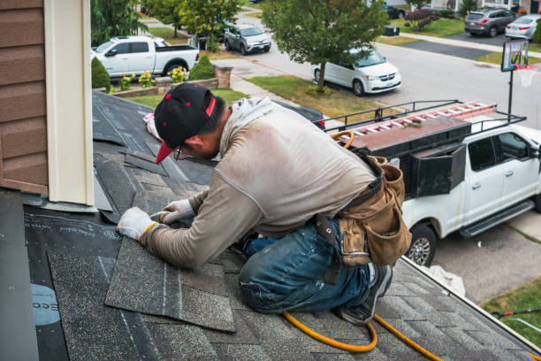 Professional Roof Replacement technician working in Cambridge, MA